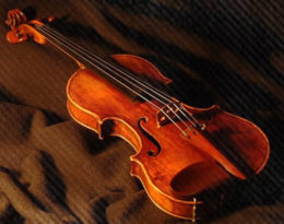 violin on red fabric